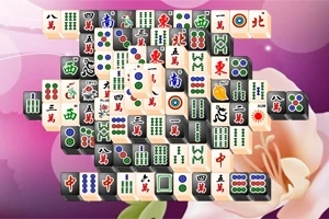 Mahjong-brikker arrangeret på en lilla baggrund med en stor blomst