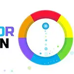Et flerfarvet, roterende hjul med en blå bold i midten og teksten COLOR SPIN ved siden af
