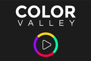Tekst COLOR VALLEY i hvidt øverst med en flerfarvet cirkel og en play-knap i midten på sort baggrund