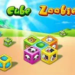 Farverige terninger med dyreansigter på en solrig baggrund med grønne bakker og teksten Cube Zoobies