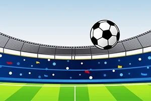 En fodbold svæver over en stadion med tilskuerrækker i baggrunden