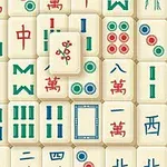 Et billede af en bunke traditionelle mahjong-brikker i forskellige farver og mønstre