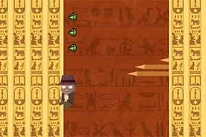 En tegneseriefigur med hat klatrer op ad en væg fyldt med hieroglyffer og undgår udspringende spyd