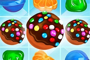 Chokoladebolde med farverige slikperler omgivet af forskellige gelé- og frugtsymboler på en blå baggrund