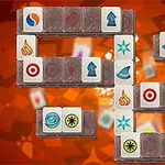 Fliser med forskellige symboler og farver på en rød og orange baggrund i et puslespilslayout