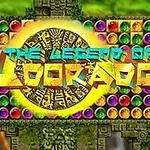 Inskription The Legend of El Dorado på en dekorativ guldfarvet cirkel omgivet af farverige ædelsten og et mønster inspireret af gamle civilisationer