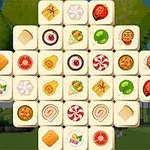 Et puslespil består af kvadratiske brikker med forskellige madillustrationer som småkager, pizza, og slik, arrangeret i et krydsmønster mod en udendørs baggrund